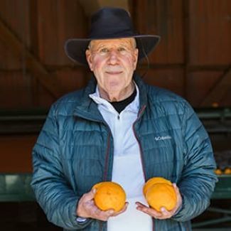 Ray Lodge holding some oranges.
