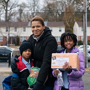 Carmen and her children at a food distribution in Philadelphia
