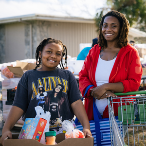 Carmen and her children at a food distribution in Philadelphia