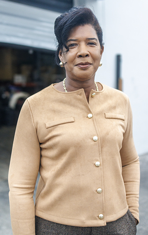 A community leader standing outside