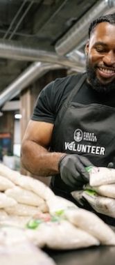 A volunteer packing food at Central CA Food Bank