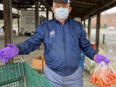 A volunteer at a food distribution