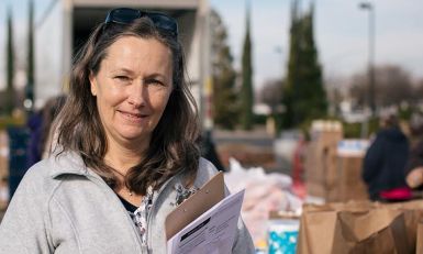 Lisa working at an outdoor food distribution.