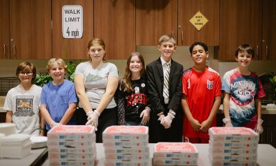 Kids smiling at the camera.