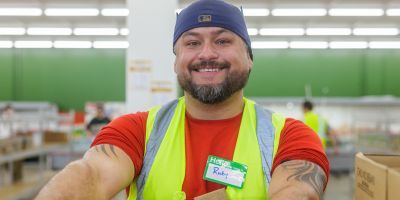 Ricky holding a box.