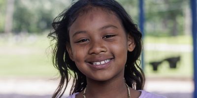 Aneah smiling while at a park.