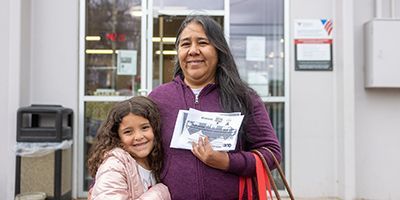 Juana and her daughter hugging each other.