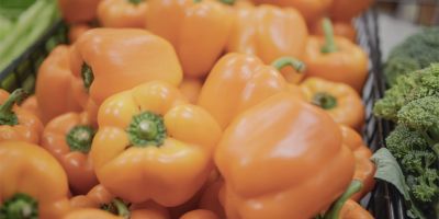 Orange peppers in a grocery store.