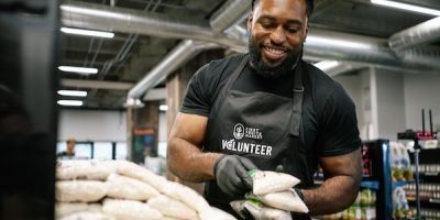 A volunteer packing food at Central CA Food Bank