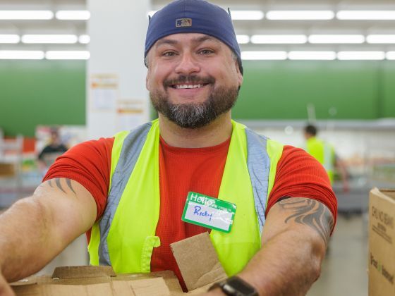 Ricky holding a box.