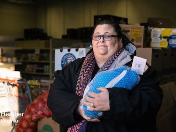 A woman holding a turkey