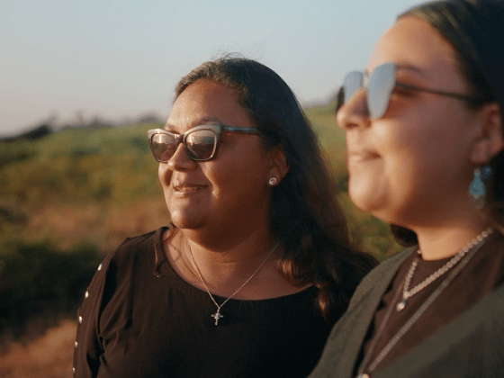 Two women looking at a sunset