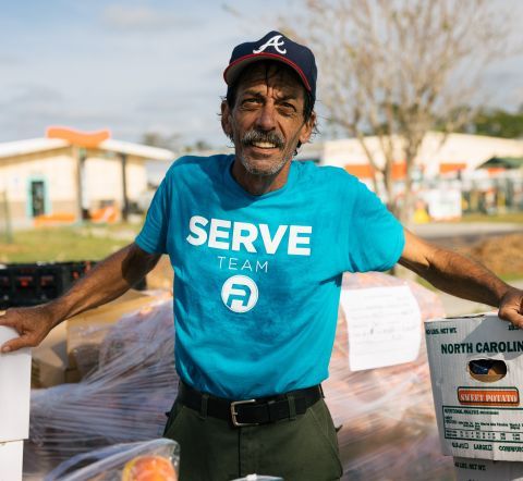 A man volunteering after Hurricane Ian.