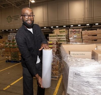 Helping to wrap a pallet