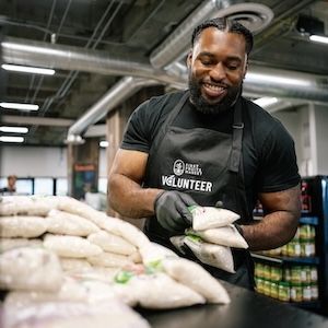 A volunteer packing food at Central CA Food Bank