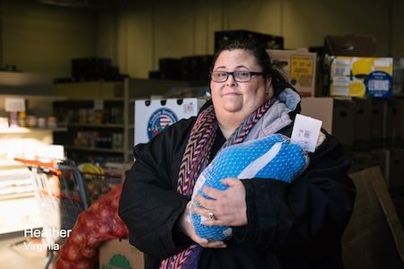 A woman holding a turkey
