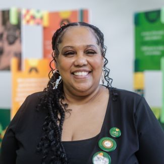 Smiling woman at a nonprofit office.