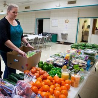 A woman helping at a diabetes management pantry.
