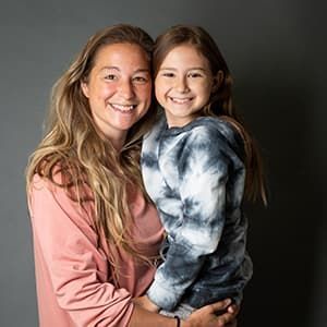 Maryann holding her 7-year-old daughter