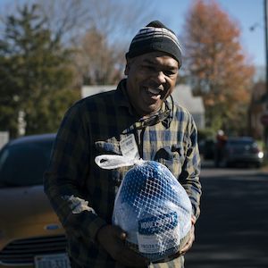 Bobby receives a turkey at food pantry during the holidays.