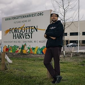 Kirk Mayes in front of the new Forgotten Harvest warehouse.