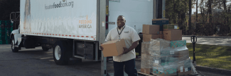 Man unloads boxes from a truck