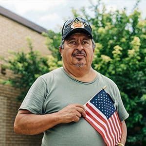 Veteran holding American flag