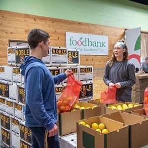 Volunteers at Food Bank of the Southern Tier in Upstate New York packing emergency food boxes