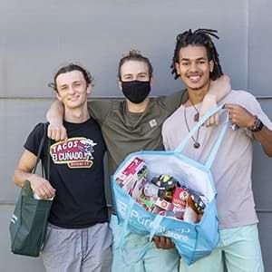 Micah, Matt and Jalen at food pantry on their college campus