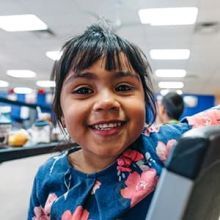 Genesis, 4, eats lunch at a summer meals program in Phoenix, Arizona.