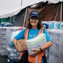 Woman holding emergency supplies.