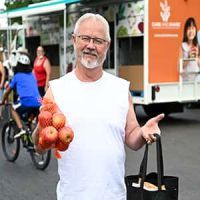 Johnnie picking up bags of nutritious food for his family. 